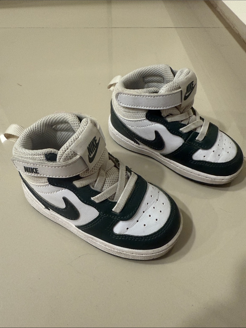 Nike Kids Mid-Top Sneakers in White and Dark Green/Black Accents